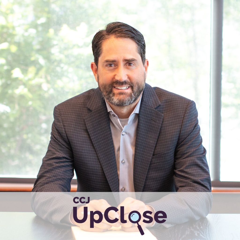 UpClose logo with headshot of Brett Tolman