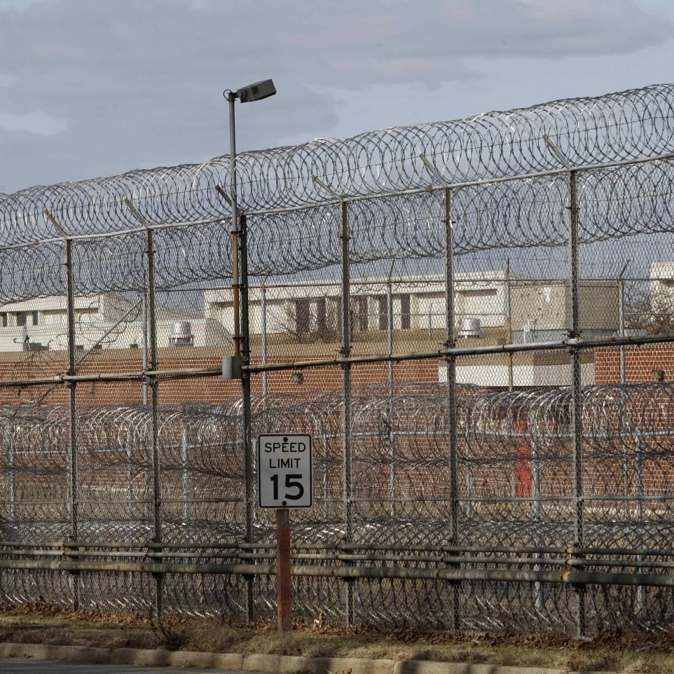 An outside of a prison with a fence
